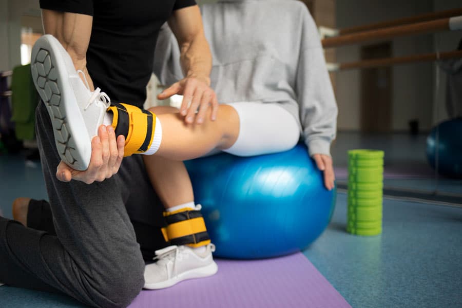 patient-doing-physical-rehabilitation-helped-by-therapists-what-is-gait-training-in-physical-therapy-2